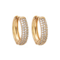 Gold-tone hoop earrings with three rows of sparkling cubic zirconia on white