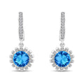 Silver-tone leverback earrings with a round blue crystal in a cubic zirconia flower frame