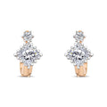 Gold-tone earrings with a large square cubic zirconia and a smaller round stone