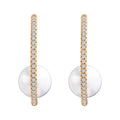 Earring with a large faux pearl in a gold-plated arc lined with cubic zirconia