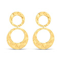 Large gold-plated earrings made of two hammered metal rings on white