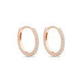 Rose gold-tone hoop earrings with a row of clear cubic zirconia