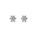 Flower stud earrings of seven white cubic zirconia in gold-plated prong settings