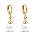 Earrings with a large white faux pearl on French hooks, gold-plated