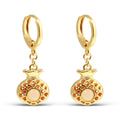 Gold-plated earrings with an openwork pineapple charm and a creamy faux pearl