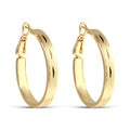 Wide gold-tone hoop earrings with fine engraving and a secure clasp