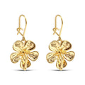 Gold-plated flower earrings with textured petals and hook fastenings on white