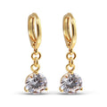 Gold-plated earrings with a large round white cubic zirconia and French hooks