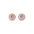 Close-up of round gold-plated studs with a light violet stone and white halo