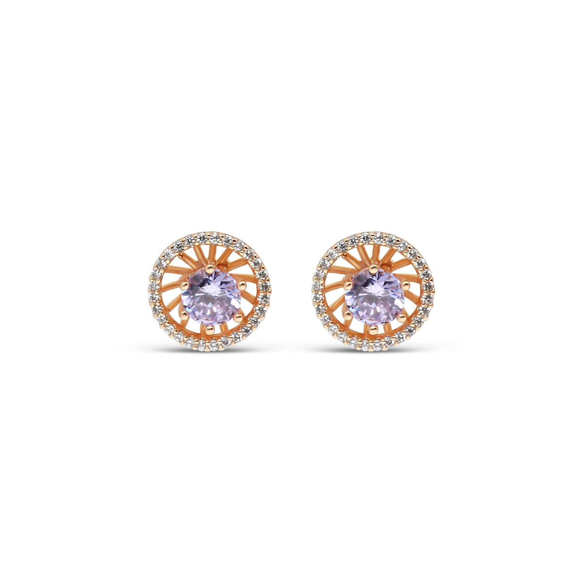 Close-up of round gold-plated studs with a light violet stone and white halo