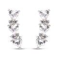 Platinum-tone earrings with three heart-shaped cubic zirconia in a gentle curve