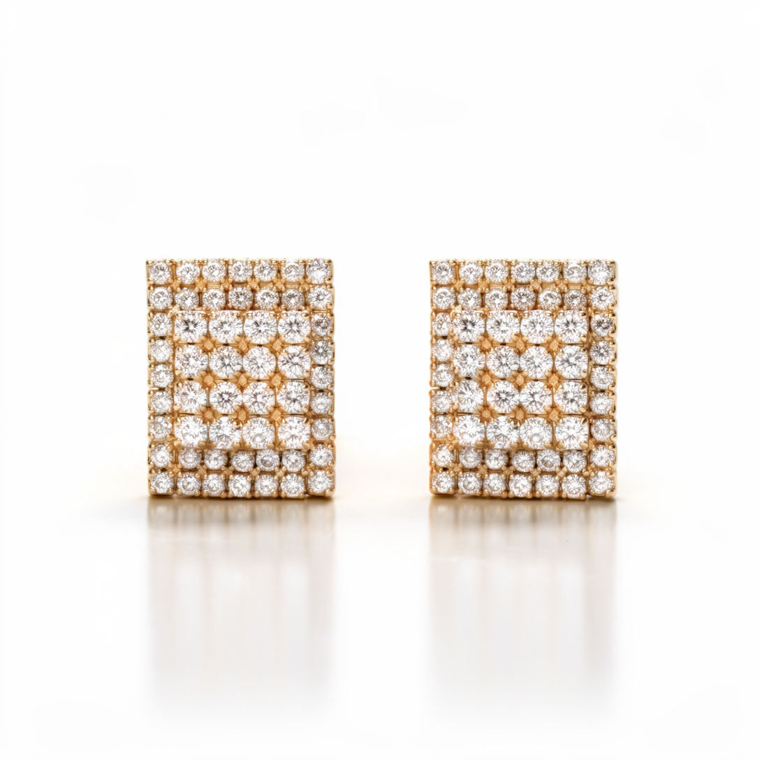 Rectangular gold-plated clip-on earrings with a dense clear cubic zirconia mosaic on white