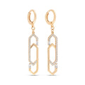 Long gold-plated earrings with elongated hexagon links and rows of clear cubic zirconia