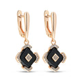 Gold-plated drop earrings with a black rhombus, clear cubic zirconia and leverback clasps