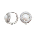 Platinum-plated earrings with a white pearl in a cubic zirconia circle, hinged clasp open