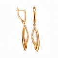 Elongated earrings with two intertwined gold-plated strands and a row of white cubic zirconia