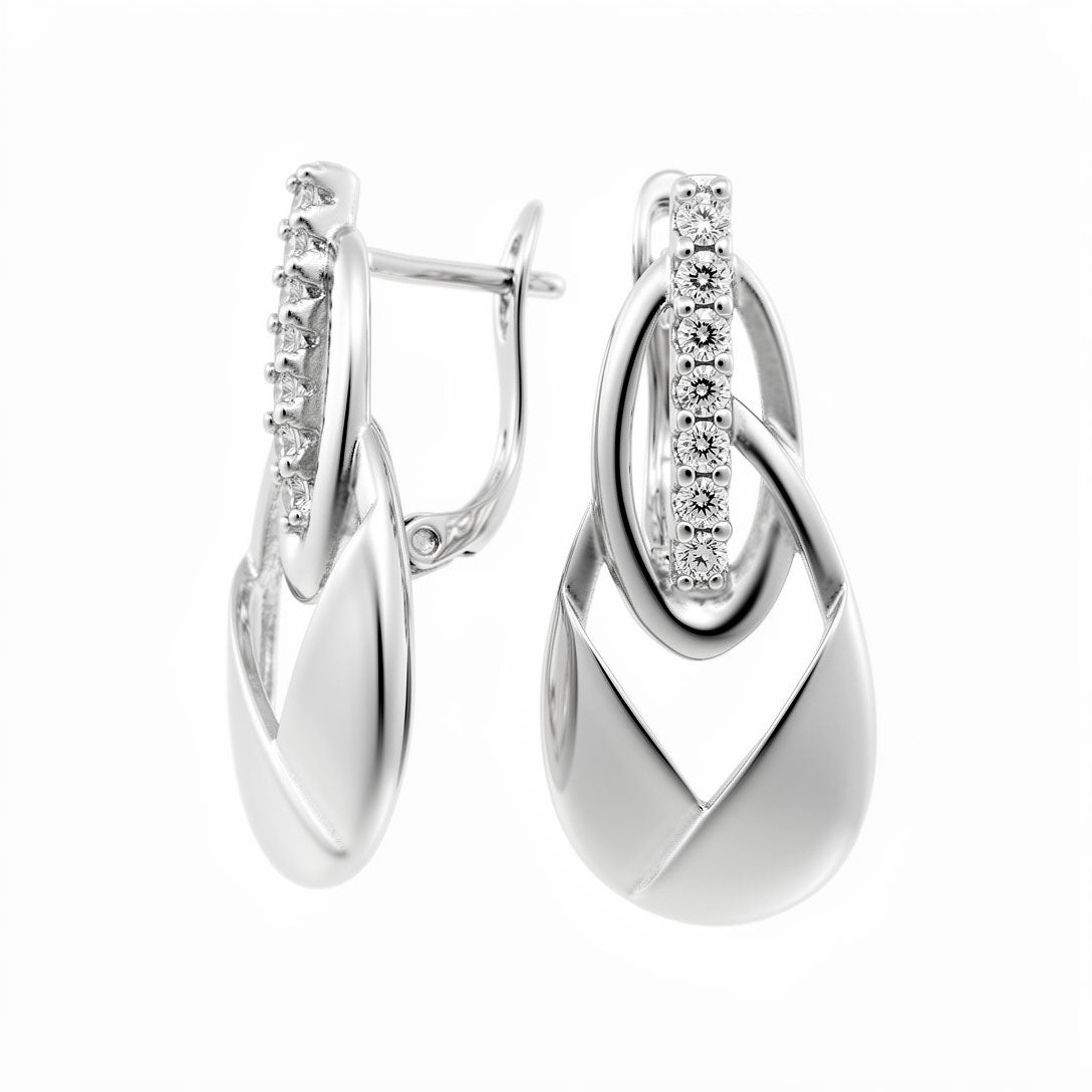 Silver-tone teardrop earrings with a zirconia band near the leverback clasp