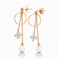 Long gold-tone earrings with a hoop, cubic zirconia clover and pearl, push-back studs