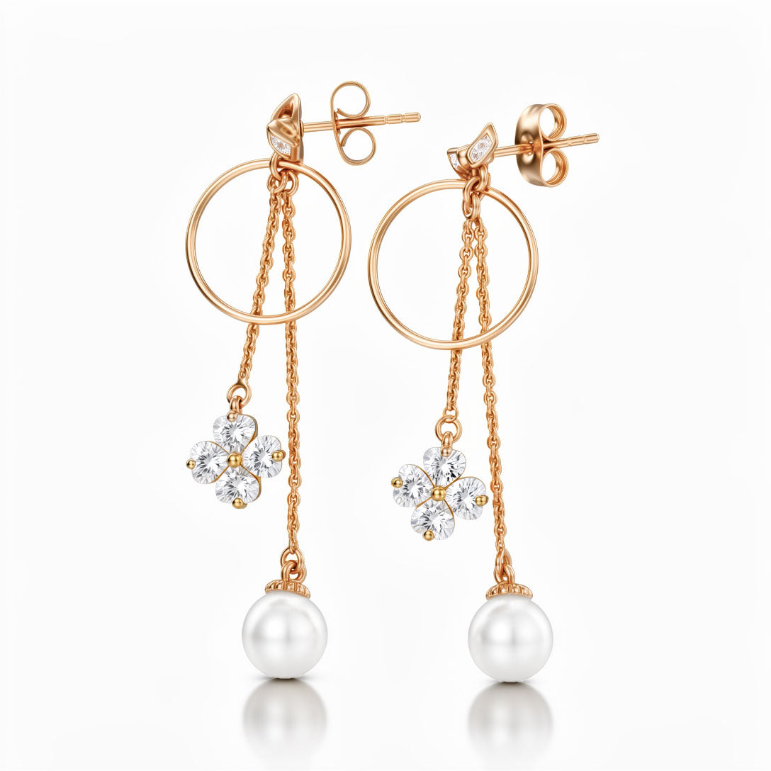 Long gold-tone earrings with a hoop, cubic zirconia clover and pearl, push-back studs