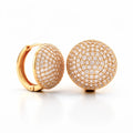 Round dome earrings densely set with cubic zirconia, hinged closure, gold tone