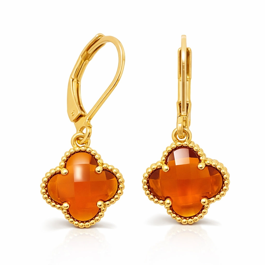 Gold-plated drop earrings with an amber-orange four-leaf stone in a beaded frame