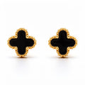Black enamel clover studs with a gold-tone beaded rim on a white background