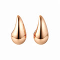 Chunky teardrop stud earrings with a smooth mirror finish in gold tone