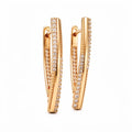 Long gold-tone earrings with two rows of sparkling cubic zirconia and leverback clasps