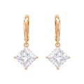 Gold-tone leverback drop earrings with rhombus cubic zirconia on white