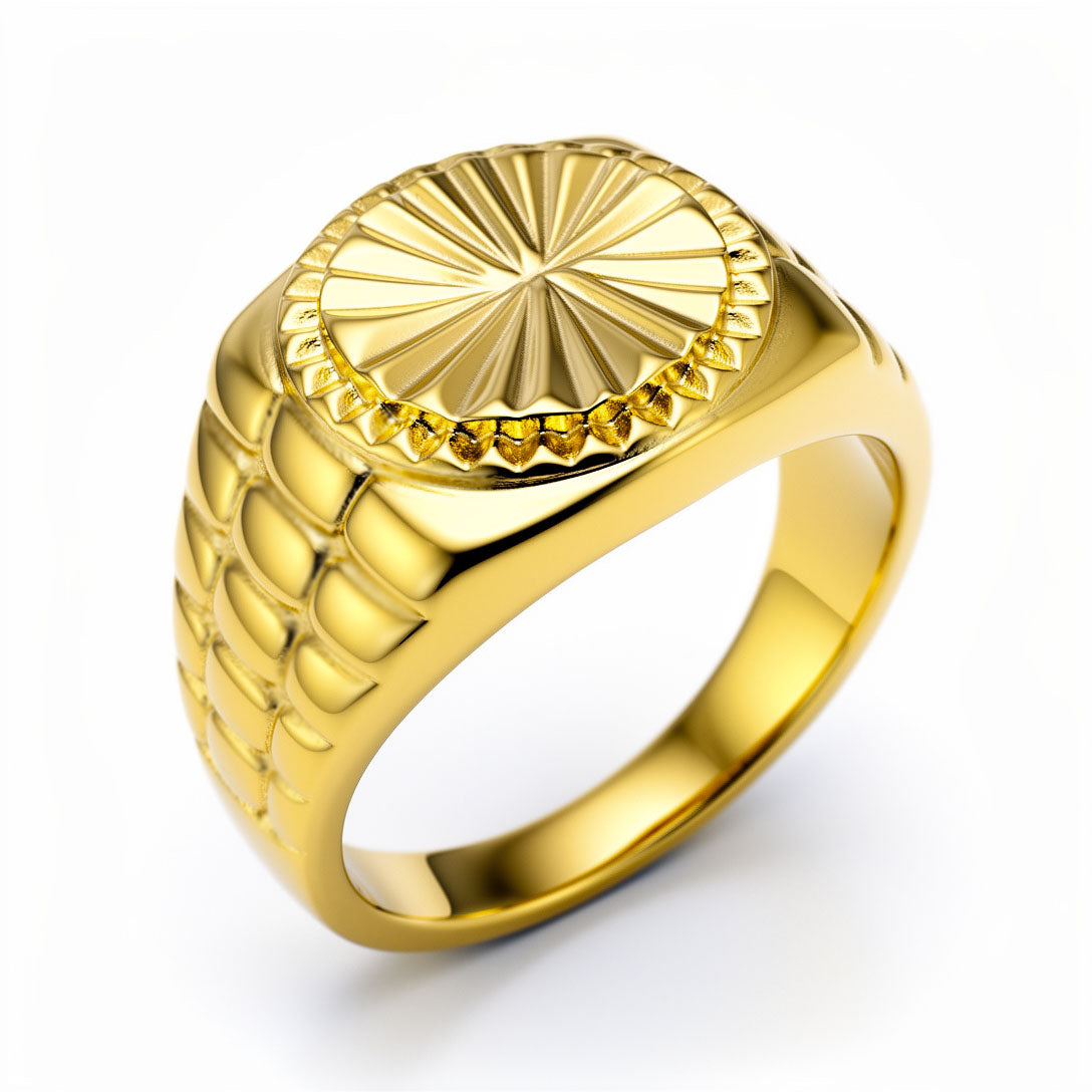 Chunky gold-plated signet ring with a sunburst pattern on an oval face