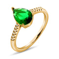 Gold-plated ring with a large green teardrop stone and white cubic zirconia
