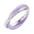 Double ring of purple ceramic and a silver-tone band with three white cubic zirconia