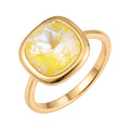 Gold-plated ring with a large yellow cushion-cut Swarovski crystal, white background