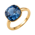 Gold-plated ring with a large 13 mm blue cushion-cut crystal on white