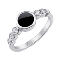 Silver-tone ring with a round black disc and six sparkling side stones