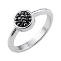 Silver-tone ring with a round inlay of black faceted crystals