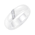 Wide white ceramic ring with a slanted row of four cubic zirconia