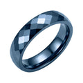 Wide blue ceramic ring with a multifaceted surface on a white background