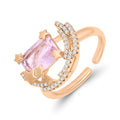 Ring with a rectangular pink stone, little stars and a cubic zirconia crescent