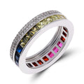 Ring with a rainbow band of square cubic zirconia between rows of clear stones