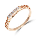 Slim gold-tone ring with five clear cubic zirconia and an openwork crown pattern