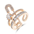 Open gold-plated ring with a star-shaped stone and a row of square stones