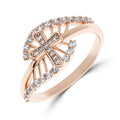Gold-plated cross ring with an arc of cubic zirconia, close-up on white