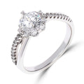 Platinum-plated ring with a large round stone and a band of side stones