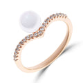 Gold-plated ring with a white pearl and a V-shaped cubic zirconia band
