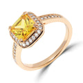 Gold-plated ring with a large square yellow cubic zirconia in a white halo