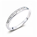 Narrow silver-tone ring with a row of round and diamond-shaped cubic zirconia