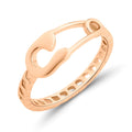 Gold-plated safety pin ring with a notched band, close-up on white