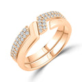 Gold-plated ring set close-up, one band smooth, the other with two zirconia rows