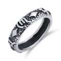Narrow steel ring with embossed symbols and darkened patterns all round